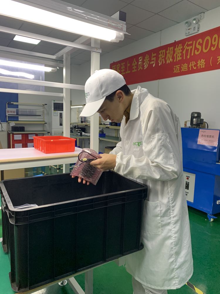 Inspecting product on the factory floor.
